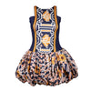 A stylish vibrant Fabrosanz bubble hem mini dress with bold blue, mustard yellow, and geometric tribal-inspired prints.